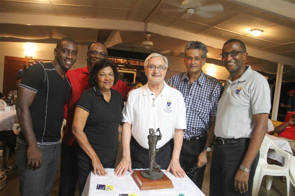 Winning pair Trent Noel and Ulric McNicol, left, along with Janet Ali (winner), Clive Pantin, Rasheed Ali (winner) and current Fatima College principal, Father Gregory Augustine, pose with the namesake Clive Pantin Trophy, at the award function following the conclusion of the Fatima Class of 1975 Charity Golf Classic held recently at Moka Golf Club, Maraval.